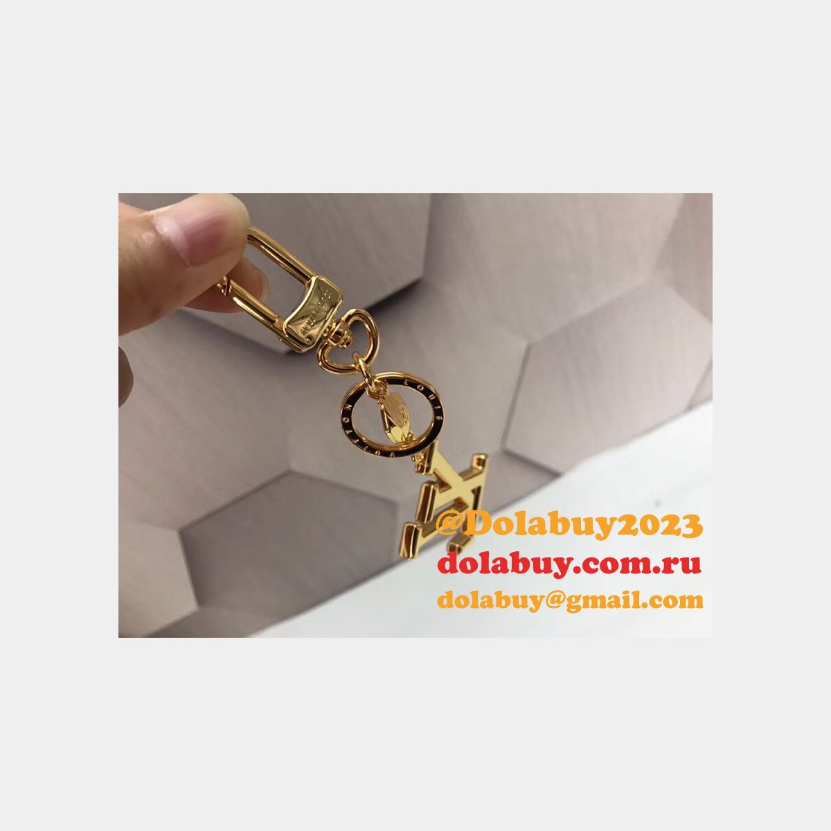 Fake LV Wholesale Facettes Bags Charm & Key Holder M65216 Gold